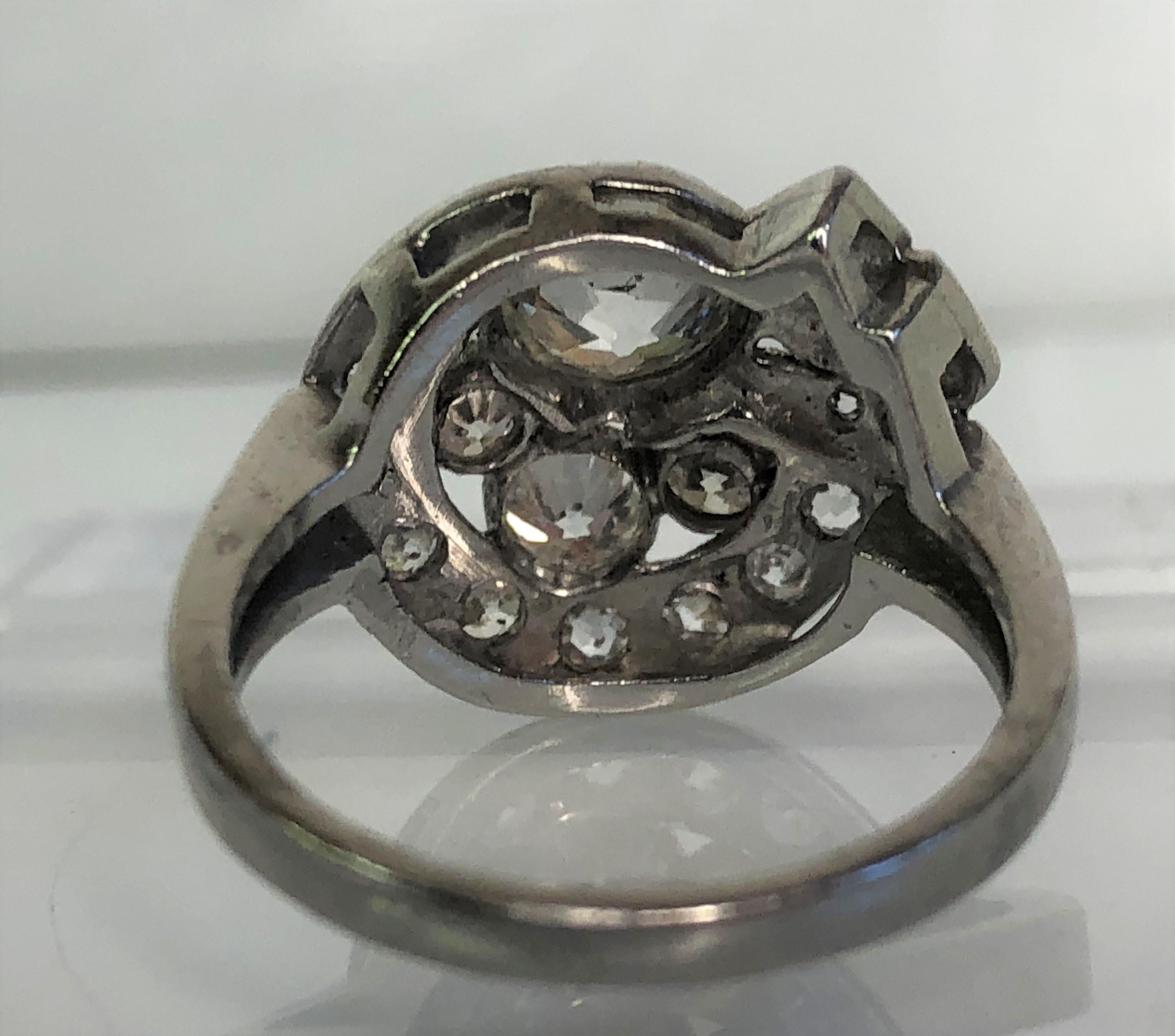 Round Cut Platinum Diamond Swirl Design Ring