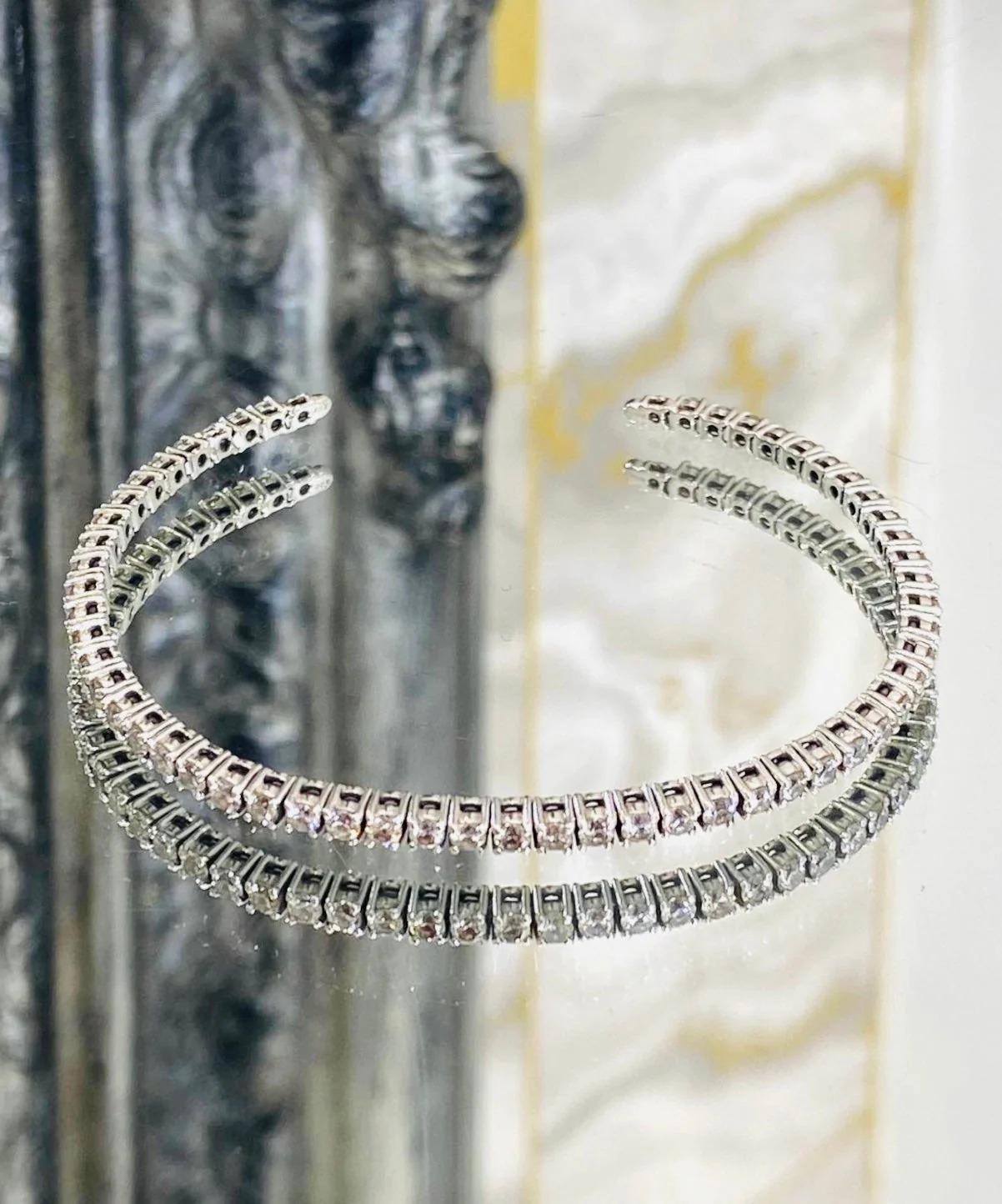 Platinum Diamond Tennis Bangle

Brilliant white diamonds set in a platinum open bangle.  54 individual diamonds which equal to approx 1.64cts.

Additional information:
Size – One Size
Composition – Platinum, Diamonds
Condition – Very Good (Some
