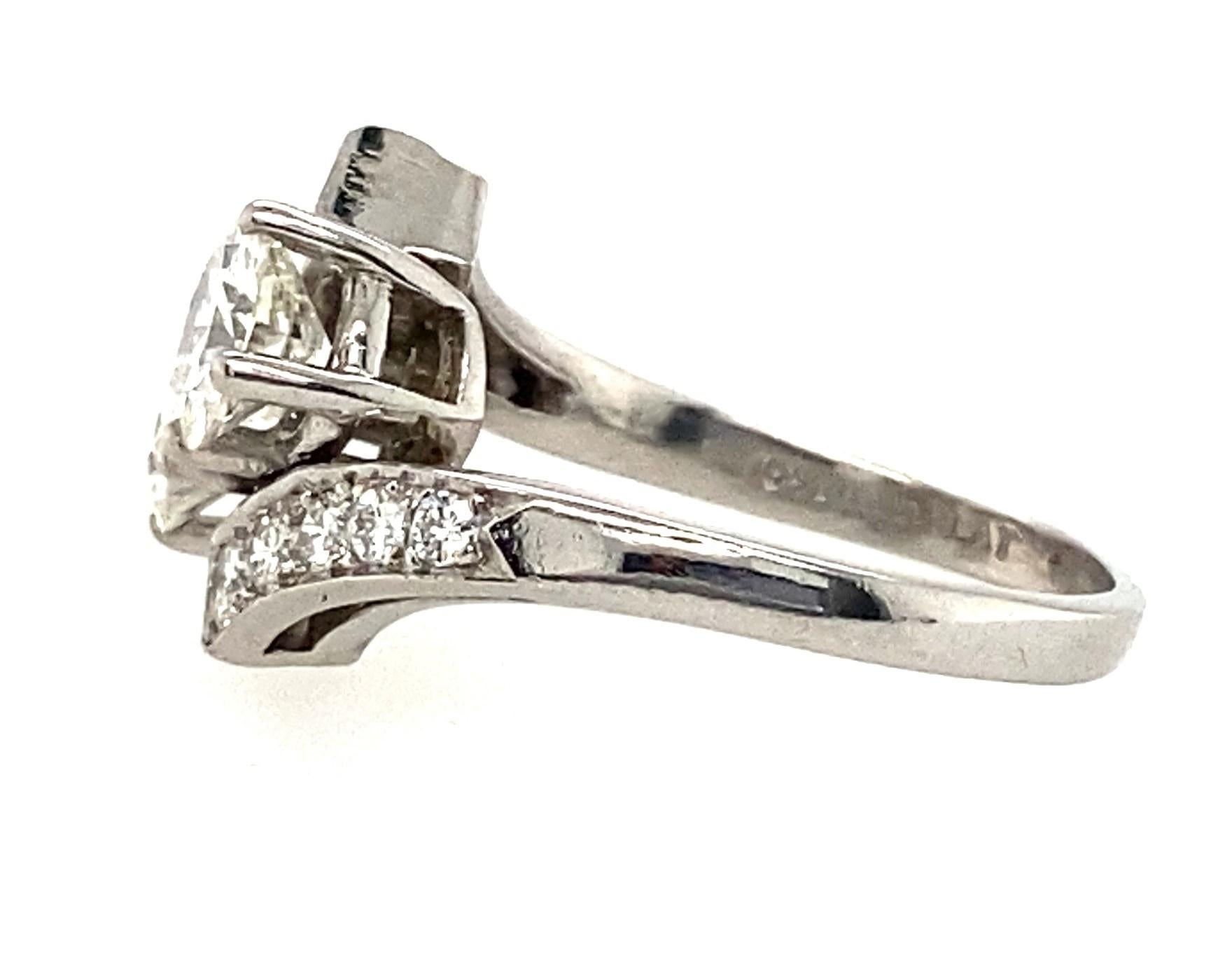 This captivating platinum and high quality diamond 1950s engagement ring is done in the toi et moi style, first popularized by the engagement ring Napoleon Bonaparte presented to his wife Josephine. 