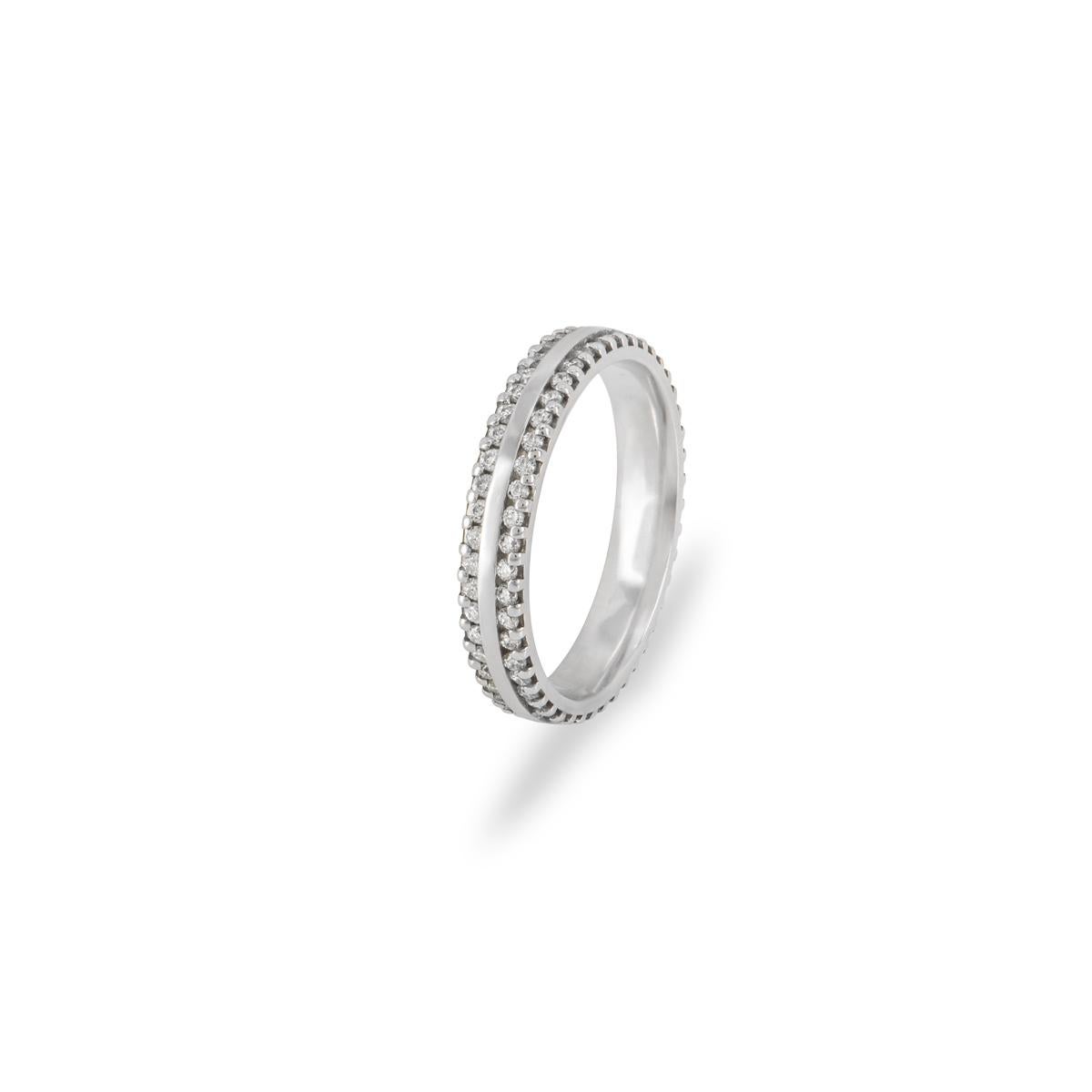 A unisex platinum diamond full eternity band. The wedding ring features two rows each pave set to the edges with 46 round brilliant cut diamonds with a combined total weight of 0.53ct, G-I colour and SI clarity. The 3.20mm ring is a size UK I - EU