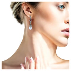 Boucles d'oreilles pendantes en platine et diamants  Style avec diamants et perles fins
