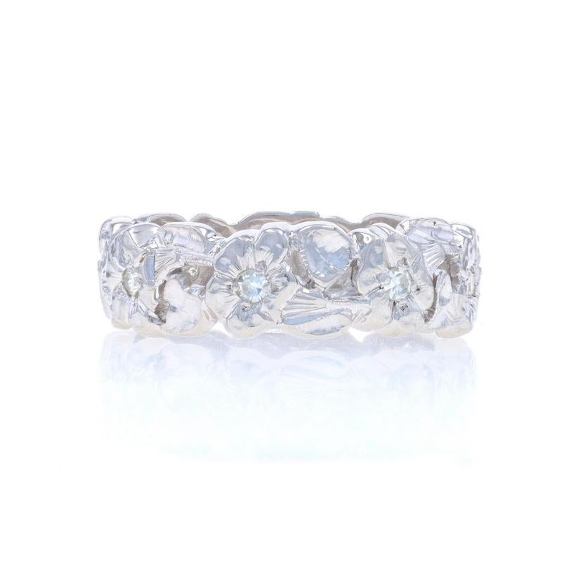 Size: 6 1/4

Era: Vintage

Metal Content: 90% Platinum

Stone Information

Natural Diamonds
Carat(s): .16ctw
Cut: Single
Color: I - J
Clarity: VS1 - VS2

Total Carats: .16ctw

Style: Eternity Band
Theme: Flower Garland

Measurements

Face Height