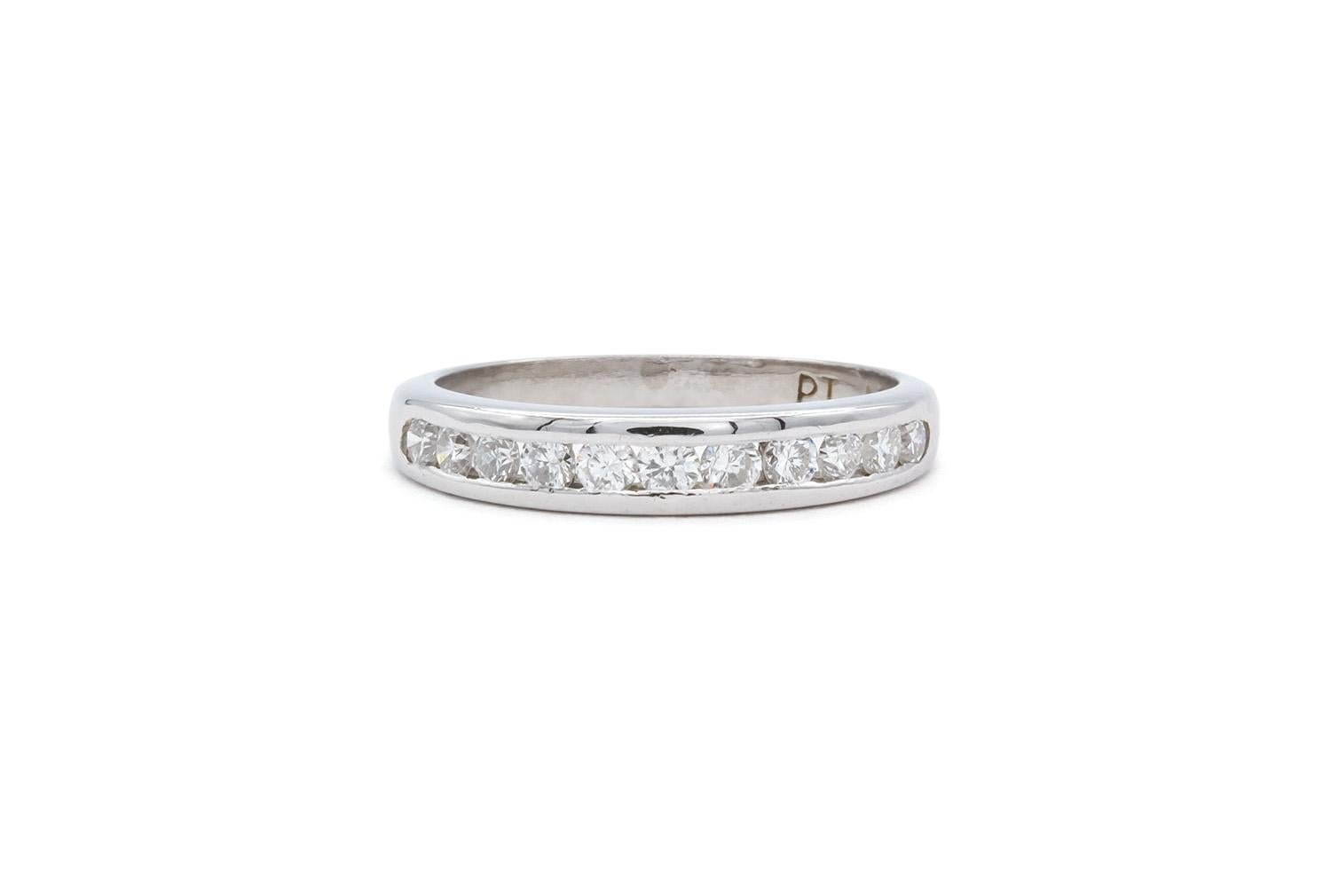 We are pleased to offer this Platinum & Diamond Wedding Anniversary Band Ring. It features and estimated 0.55ctw F-G/VS-SI Round brilliant Cut Diamonds set in .950 Platinum. It is a size 5 US and tappers from 3.5mm down to 2.0mm wide. The ring is in