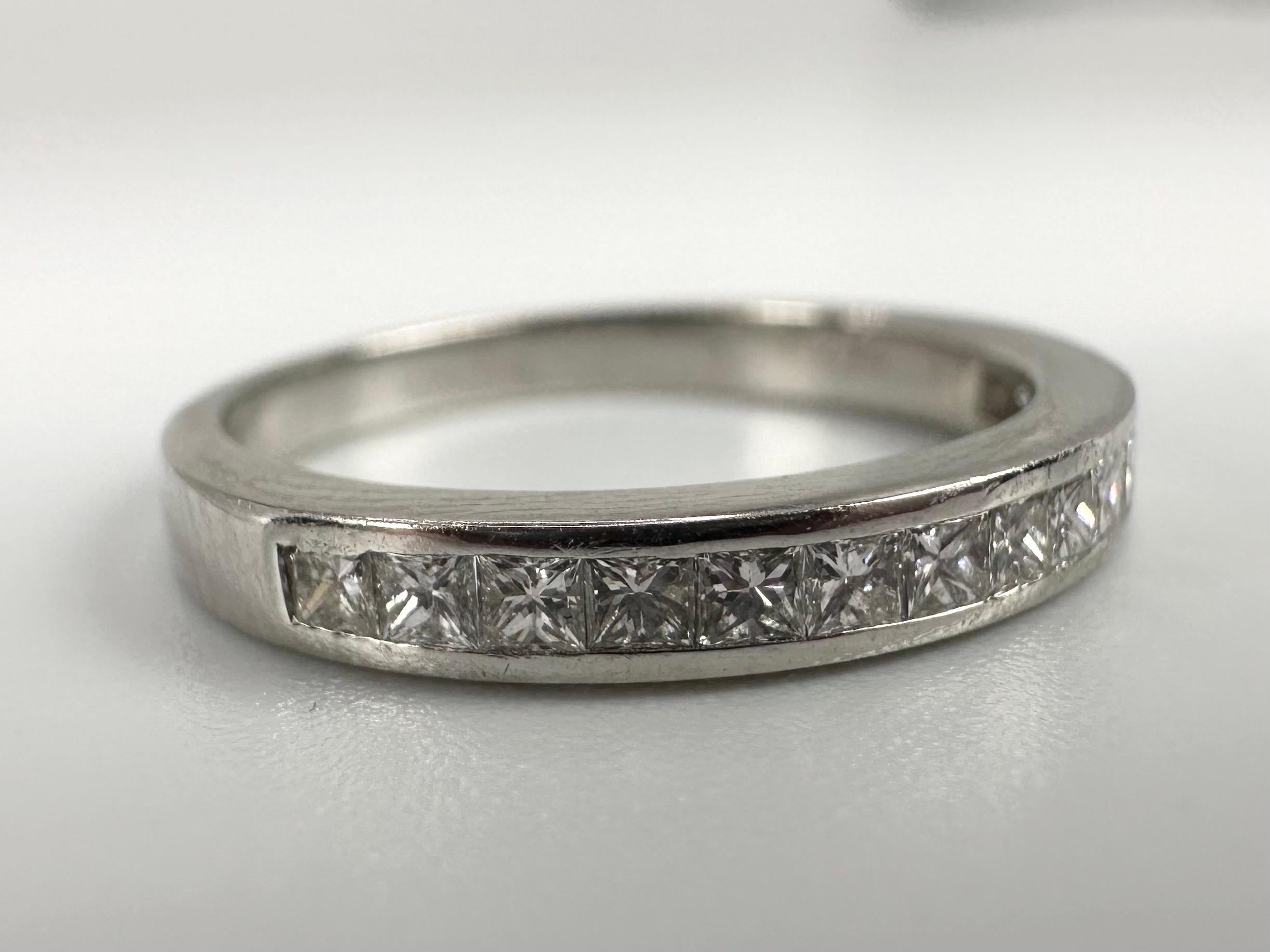 Stunning platinum diamond band with square diamonds in channel setting design.

metal: PLATINUM
NATURAL DIAMOND(S)
Clarity/Color: VS-SI/F-G
Carat:0.30ct
Cut:Square Brilliant (Princess)
Grams:3.42
size: 5
Item#: 110-00049PRA

WHAT YOU GET AT STAMPAR