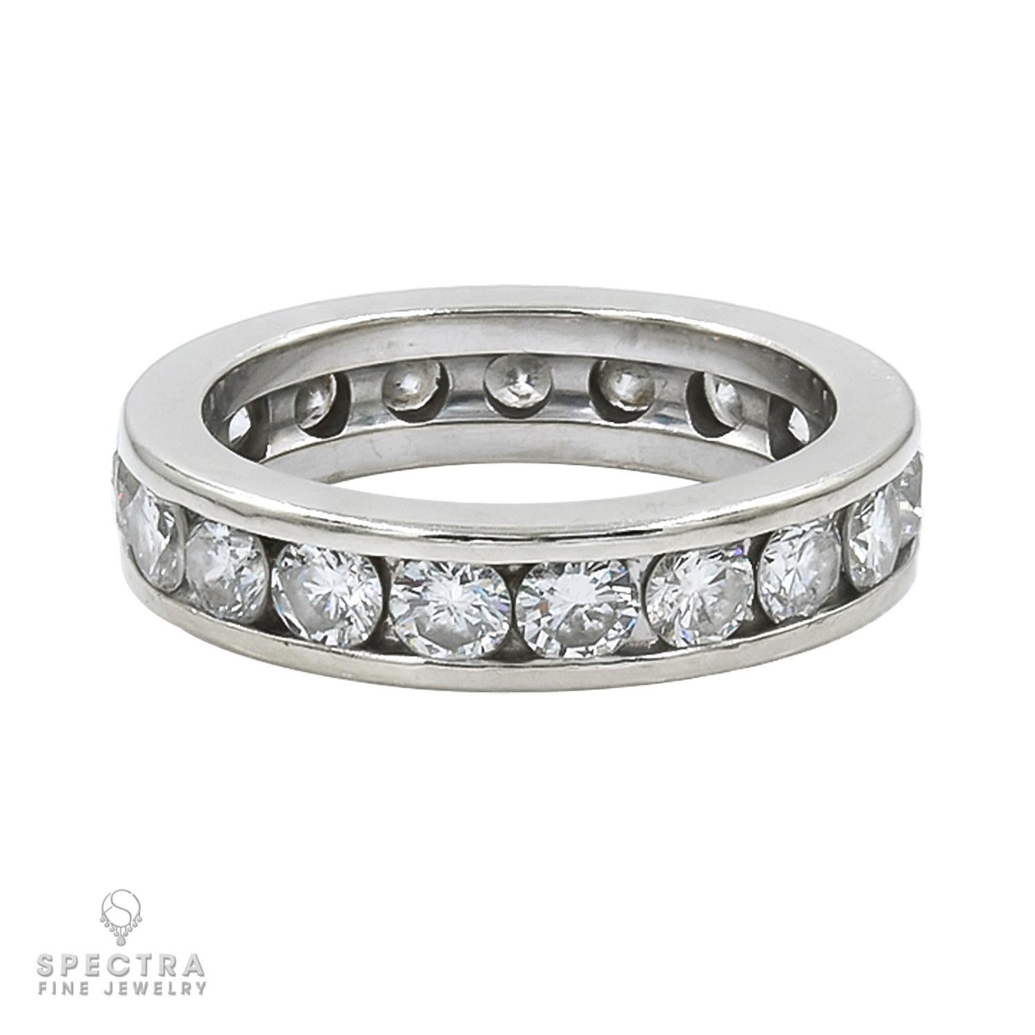 A timeless expression of love and commitment, this stunning channel-set diamond wedding band features a full circle of 19 dazzling round diamonds, with a total approximate weight of 2.47 carats. Each diamond is elegantly nestled within a sleek