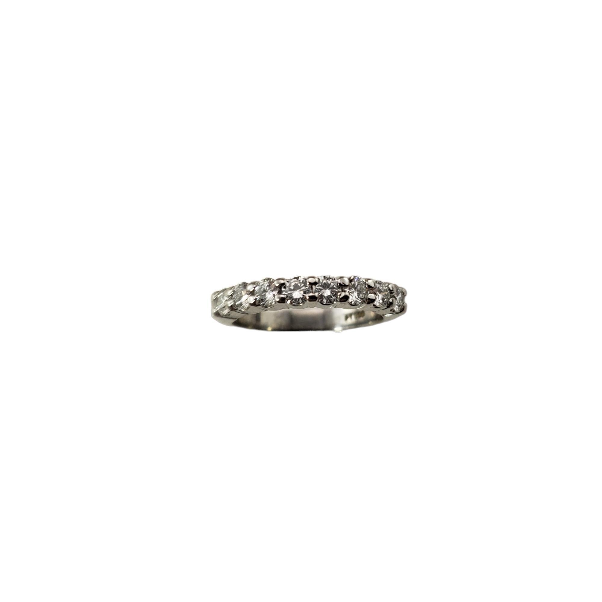 Vintage Platinum Diamond Wedding Band Ring Size 4.5-

This sparkling band features eight round brilliant cut diamonds* set in classic platinum.  Width: 3 mm.  

*Chip noted to one stone not visible to naked eye.

Approximate total diamond weight: