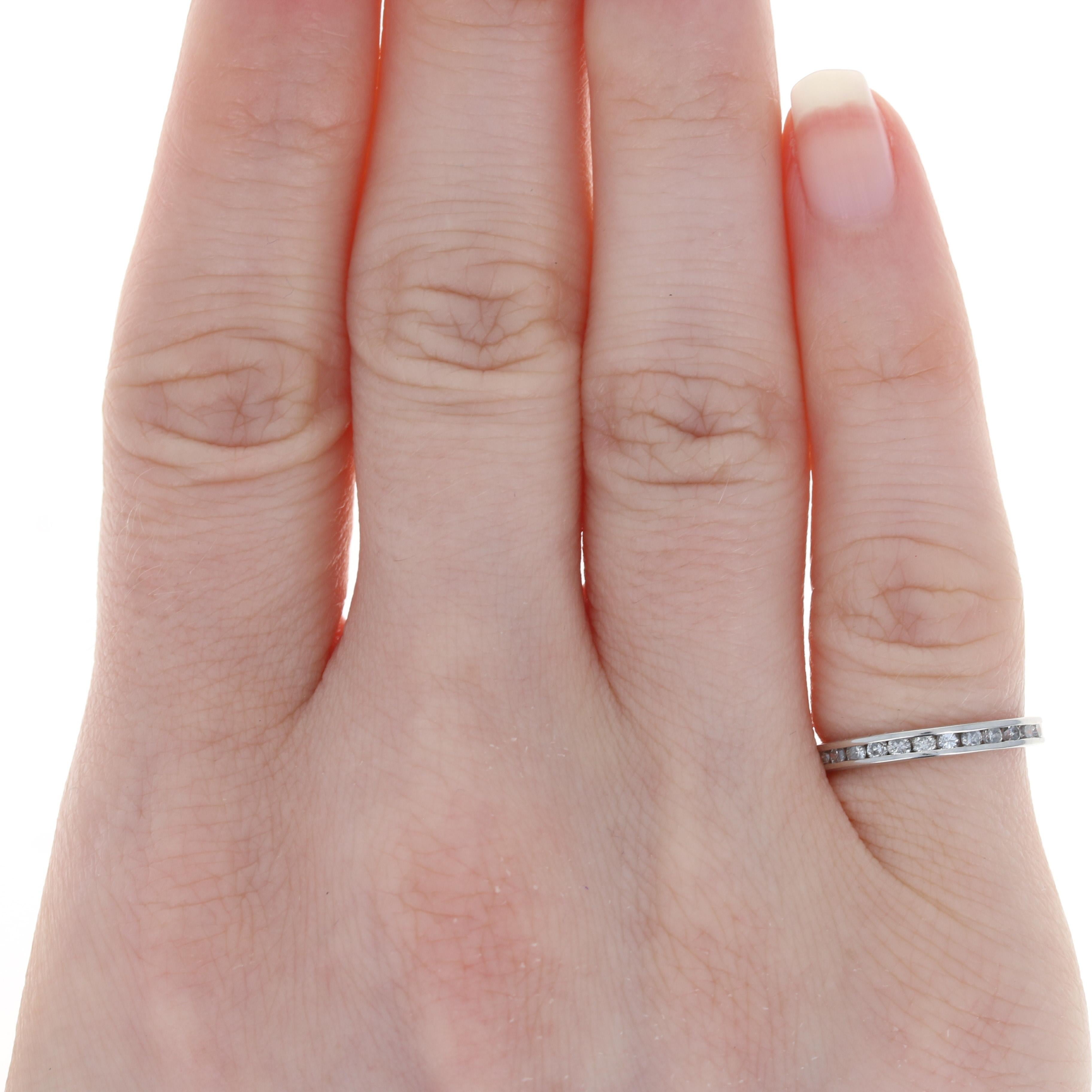 Size: 3 3/4
 Sizing Fee: Down 1 size for $30 or Up 2 sizes for $35
 
 Metal Content: Platinum
 
 Stone Information: 
 Natural Diamonds
 Total Carats: .18ctw
 Cut: Round Brilliant
 Color: G - H
 Clarity: SI2 - I1
 
 Style: Wedding Band with Diamonds
