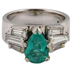 Retro Platinum Diamonds And Emerald Engagement Ring