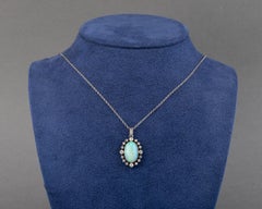 Collier pendentif Belle Époque en platine, diamants et opale