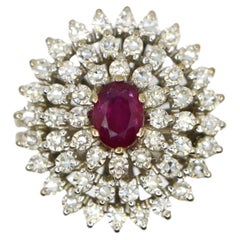 Anello in platino con diamanti e rubino