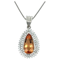 Collier en platine, double halo de diamants et topaze