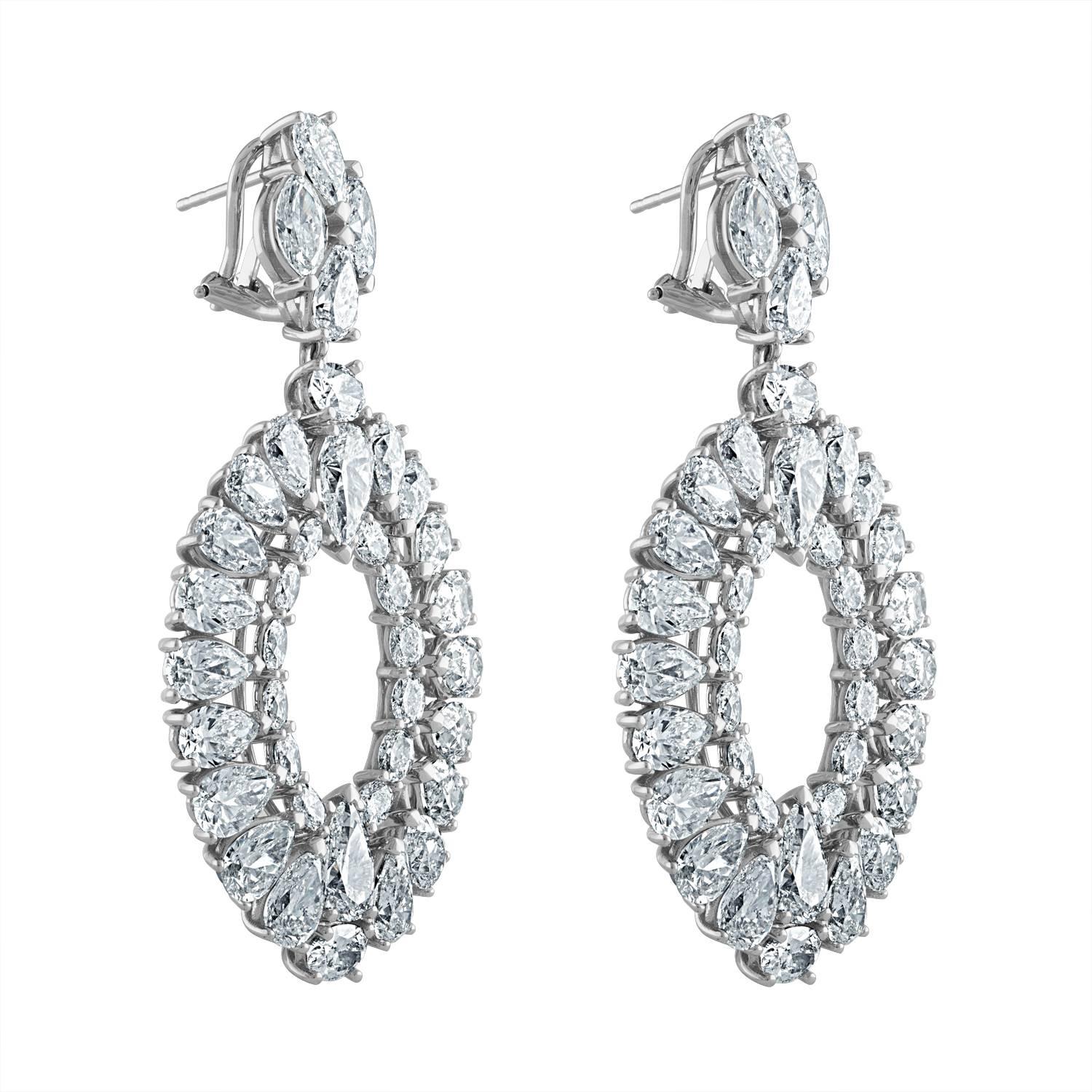 Pear Shape, Marquis and Oval Shape Diamonds are set in Platinum Earrings. The Earring is approximately 2.5 