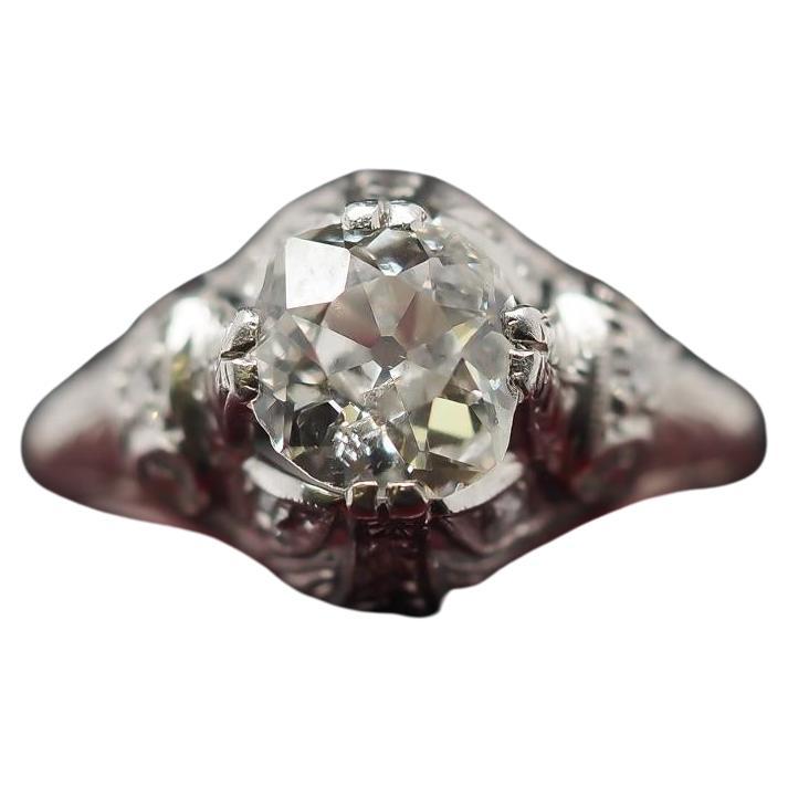 Year: 1900s

Item Details:
Ring Size: 6.5 (Sizable)
Metal Type: Platinum [Hallmarked, and Tested]
Weight: 3.8 grams

Diamond Details: 1.25ct, Old Mine brilliant, J Color, I1 Clarity (Eye Clean), Natural Diamond.

Band Width: 1.5mm
Condition: