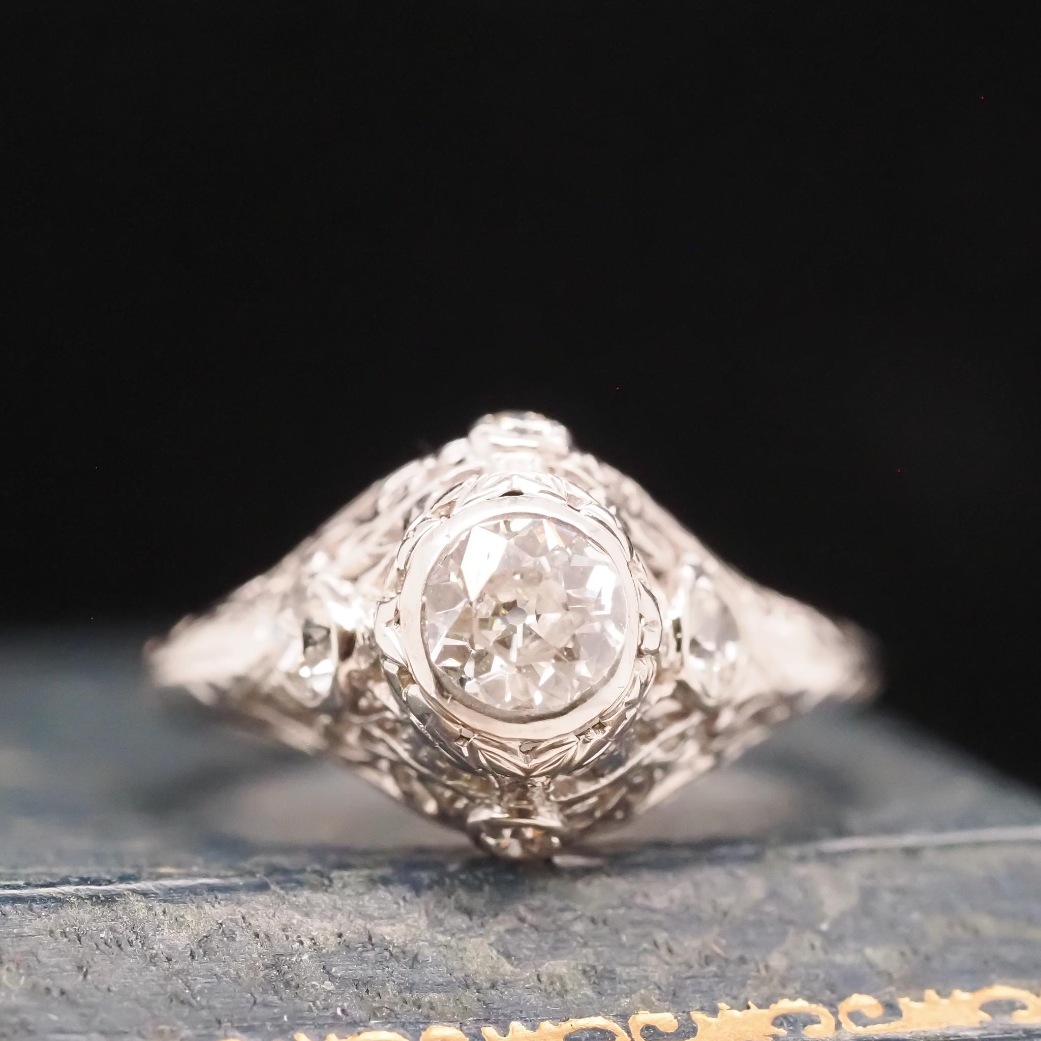 Year: 1922 (Engraved inner shank)
Item Details:
Ring Size: 4.5 (Sizable)
Metal Type: Platinum [Hallmarked, and Tested]
Weight: 3.7 grams
Diamond Details: .50ct, total weight. Old European Brilliant. H Color, VS Clarity
Band Width: 1.55mm
Condition: