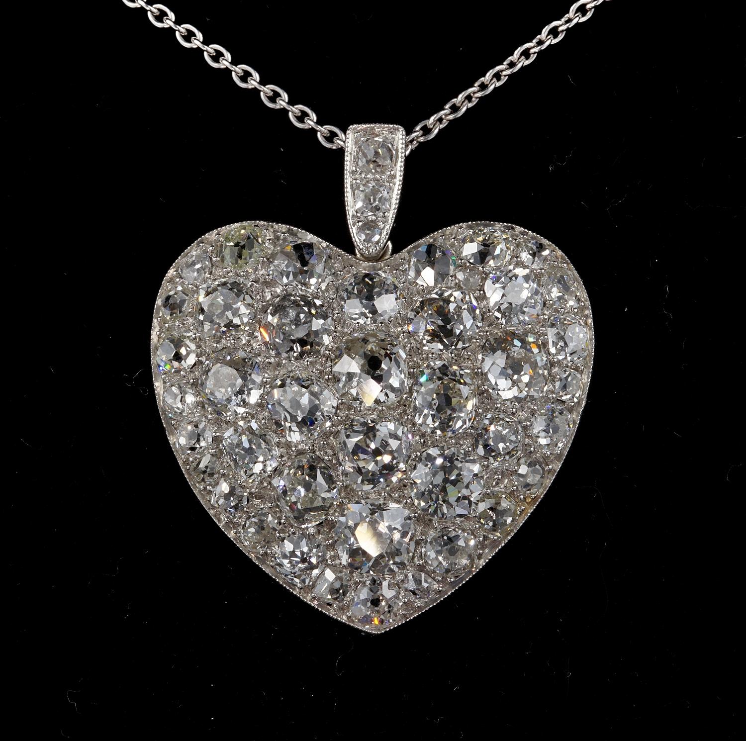 Spectacular Love Token
Stunning find from the Edwardian period
Authentic 1905 ca solid Platinum Crafted large Heart Pendant displaying a huge amount of old mine cut Diamonds all large and chunky in cut giving out a phenomenal amount of sparkle being