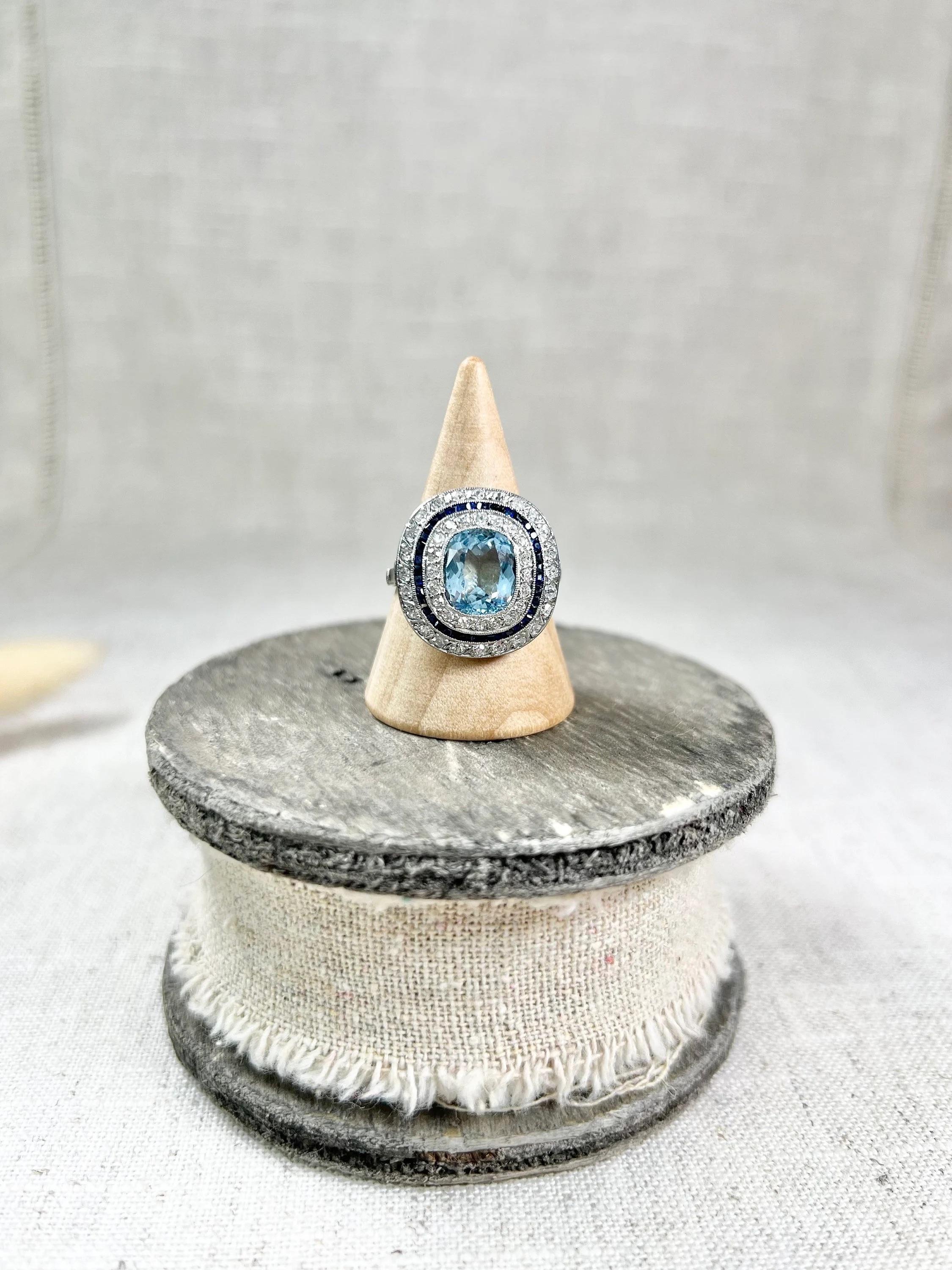 Platinum Edwardian Cushion Cut Aquamarine, Old Cut Diamond & Sapphire Halo Ring In Good Condition For Sale In Brighton, GB