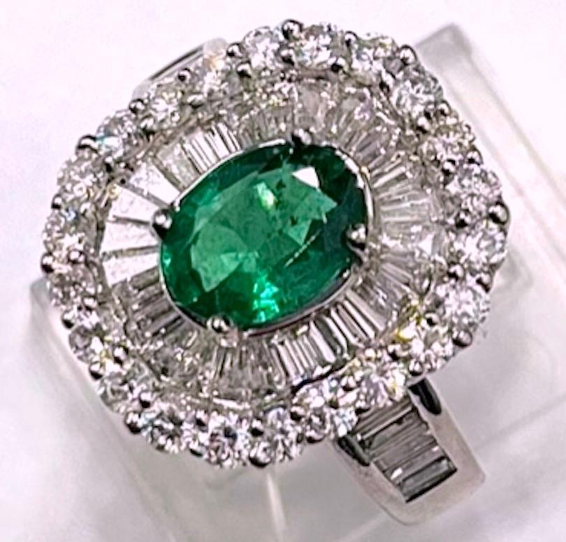 Contemporary Platinum Emerald And Diamond Ballerina Ring For Sale
