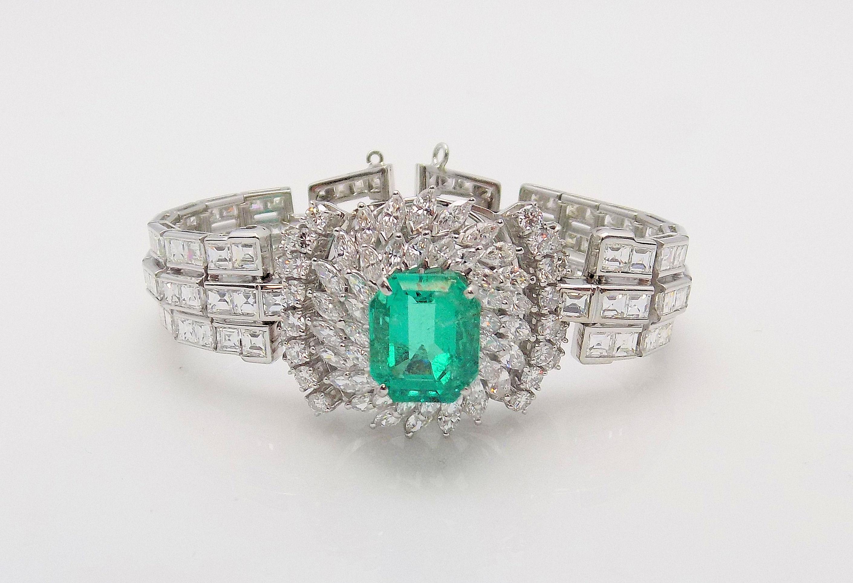 Stunning Platinum Bracelet featuring One Emerald Cut Emerald of 7.30 Carats; 24 Round Brilliant Diamonds, 42 Marquis Cut Diamonds and 112 Square Cut Diamonds 25.00 Carat Total Weight, VVS, G; Circa 1940; 6 1/8