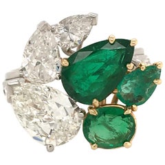 A Platinum, Emerald and Diamond Ring