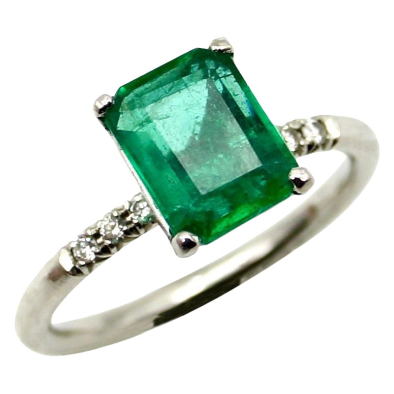 Platinum Emerald and Diamond Solitaire Ring