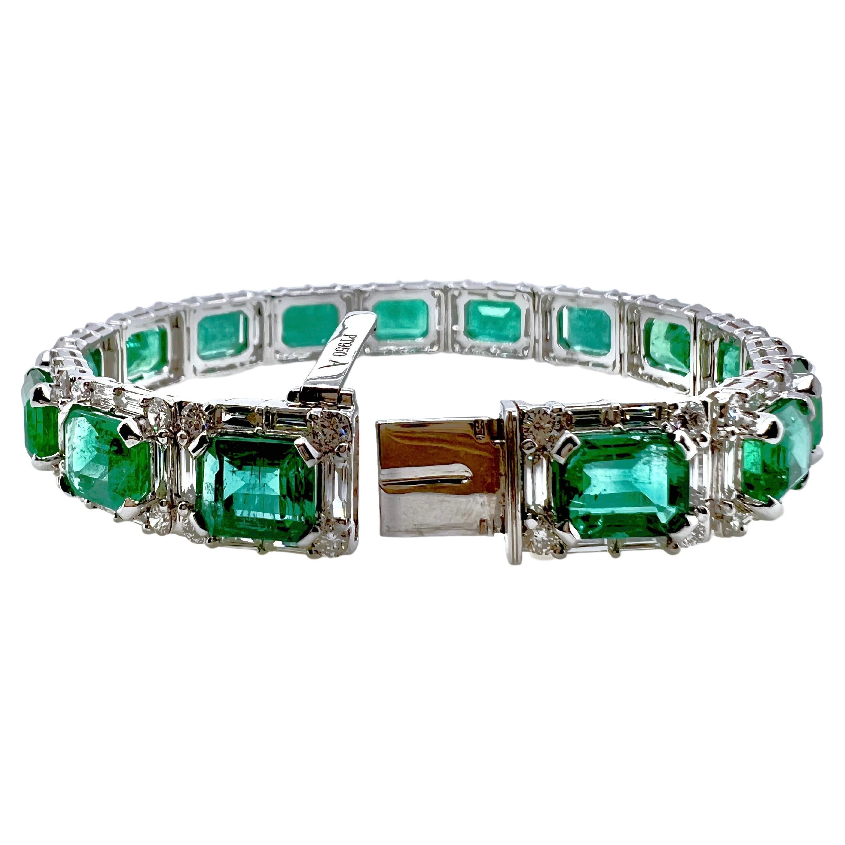 This stunning emerald is an absolute must for the emerald lovers.  The handmade setting for the emeralds truly exhibit the quality and workmanship.  The platinum setting contains the baguette and round diamonds that housed the vibrant, emerald cut