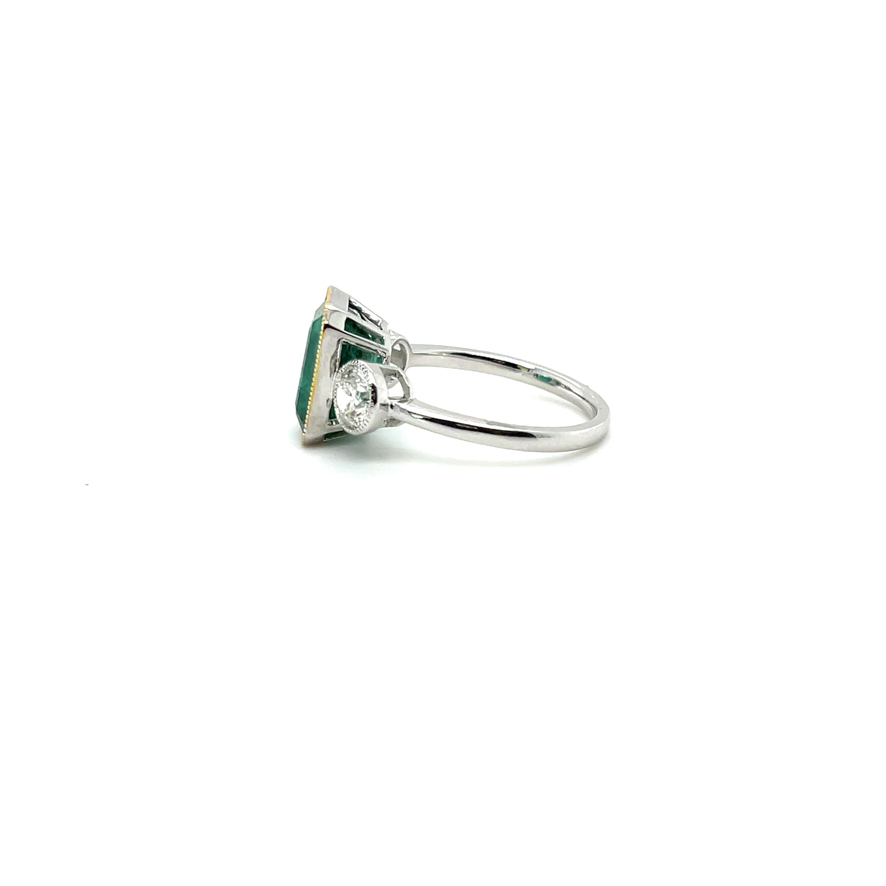 An absolutely gorgeous Emerald, gorgeous colour, Lustre and Transparency, featuring 2 stunning diamonds , gorgeously crafted in platinum , complimented by a polished finish design. 


One ladies - platinum three stone ring, narrow, half round,