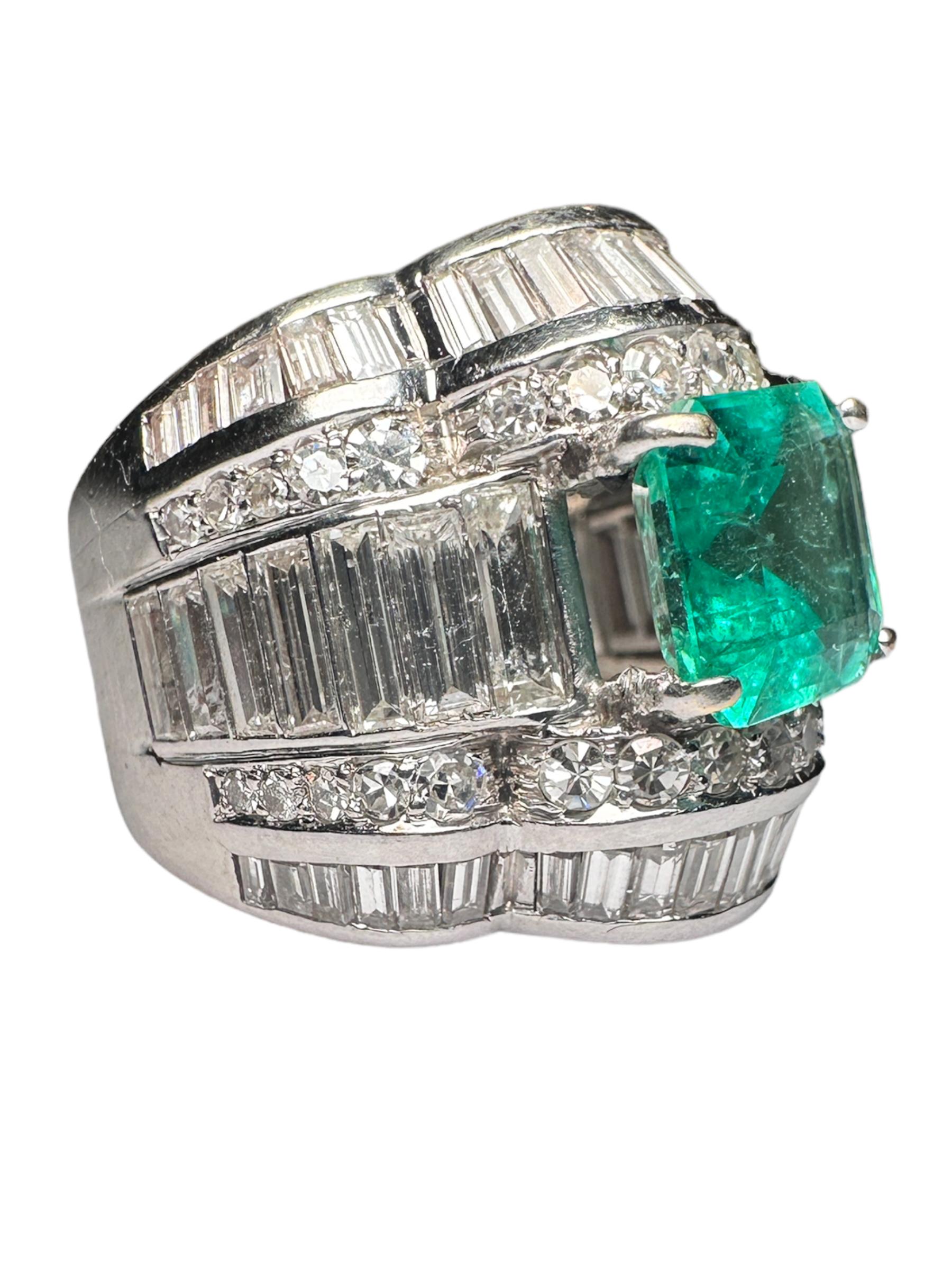 Elegant and timeless, this platinum ring is a true masterpiece, featuring a stunning octagonal step-cut natural emerald as its centerpiece. The emerald, weighing 2.55 carats, exhibits a captivating green hue and measures 8.42 x 8.40 x 4.92 mm.