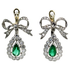 Platinum Emerald Diamond Bow Earrings
