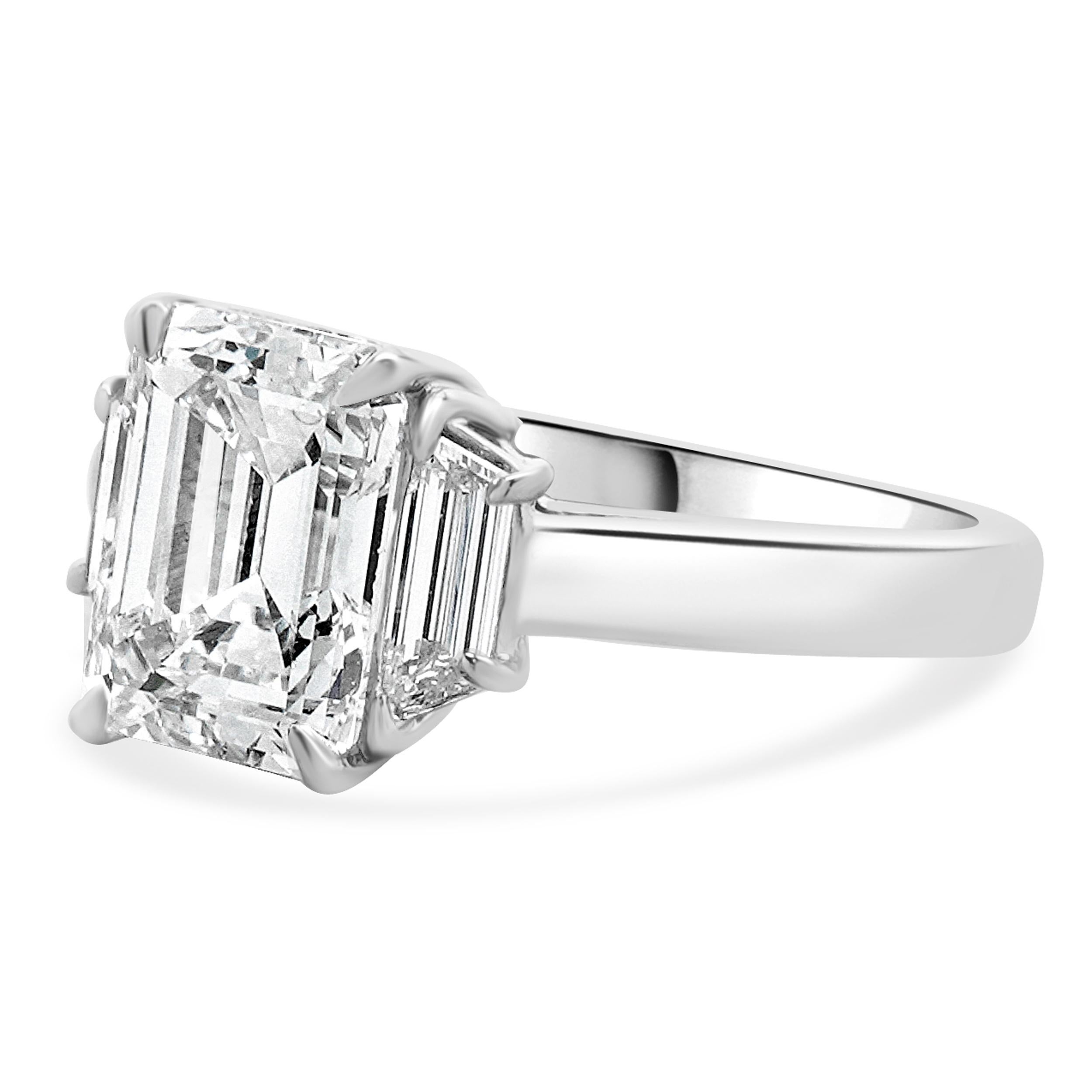 Material: platinum
Diamond: 1 emerald cut = 2.23ct
Color: E
Clarity: VS2
GIA: 5231373022
Diamond: 2 trapezoid cut = 0.40cttw
Color: F
Clarity: VS2
Ring Size: 5.75 (please allow up to 2 additional business days for sizing requests)
Dimensions: ring