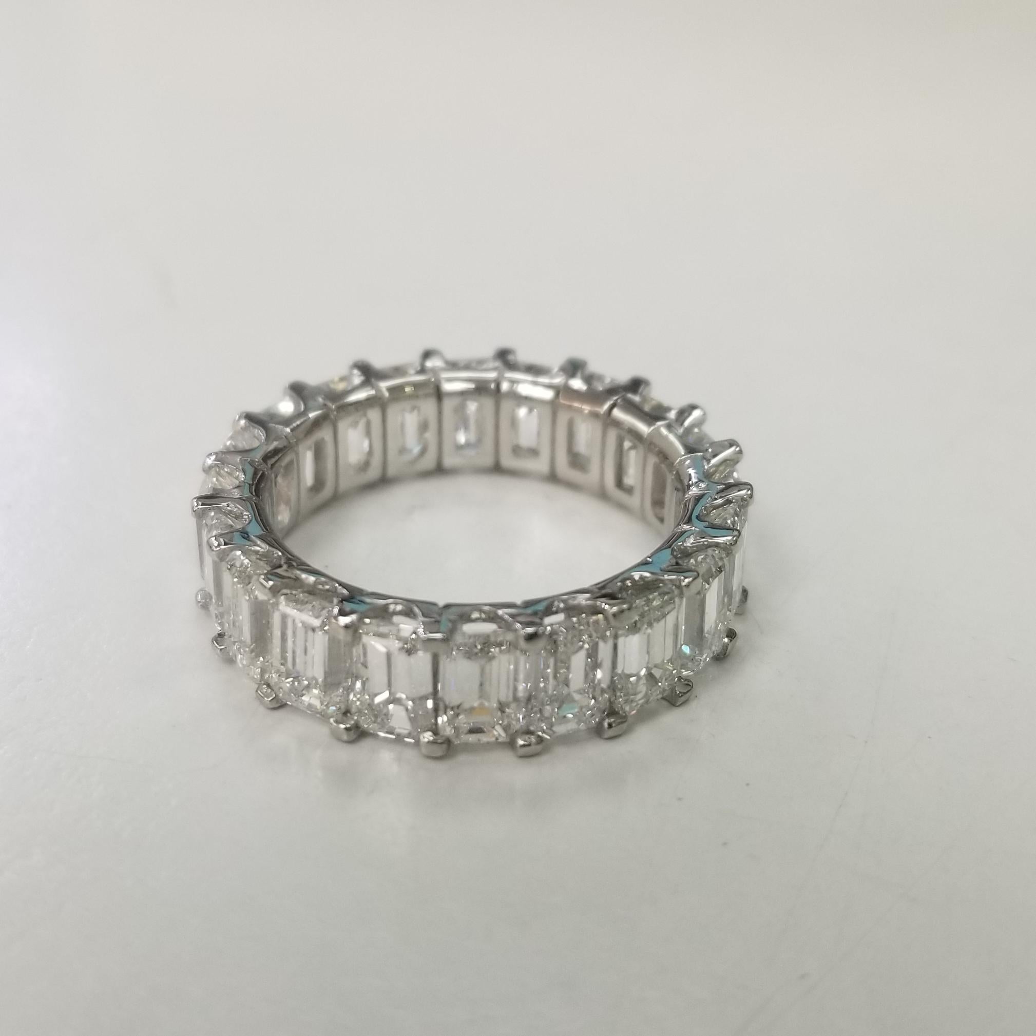 This diamond eternity ring is an endless commitment of love.  This large diamond eternity ring features a full circle of natural emerald cut brilliant diamonds in a shared-prong Platinum setting. Diamonds are graded Color E-F, Clarity VS1 and each