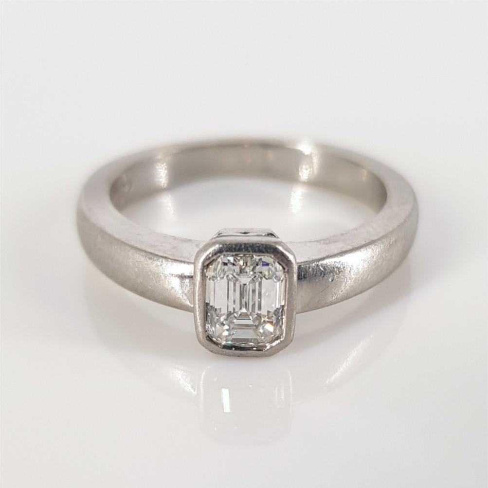Beautiful and bold, this ring says it all. Set in Platinum and weighing 6 grams, this ring features 1 Emerald Cut Diamond (GH vs) weighing 0.47carat, and is a size J