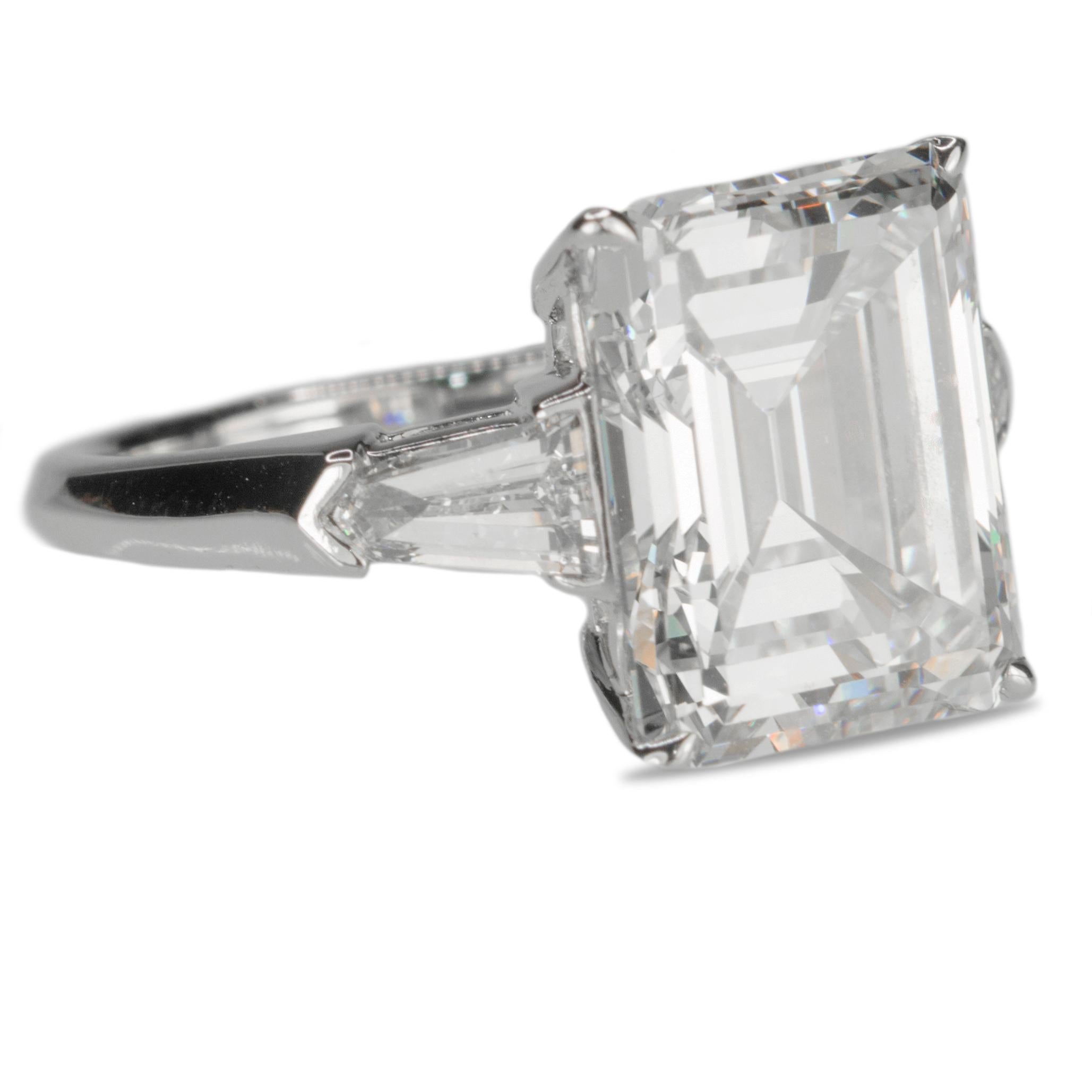 Platinum ring with GIA certified 3.16 carat I color VS1 clarity emerald cut diamond and 2 tapered baguette diamonds weighing approximately 0.40 carats. 