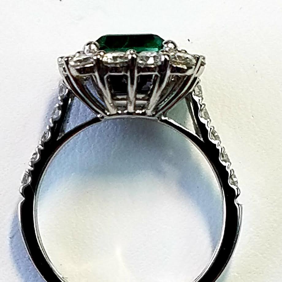 Contemporary Platinum Emerald Cut Emerald and Diamond Ring