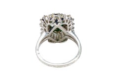 Platinum Emerald-Cut Emerald and Double-Halo Ballerina Ring