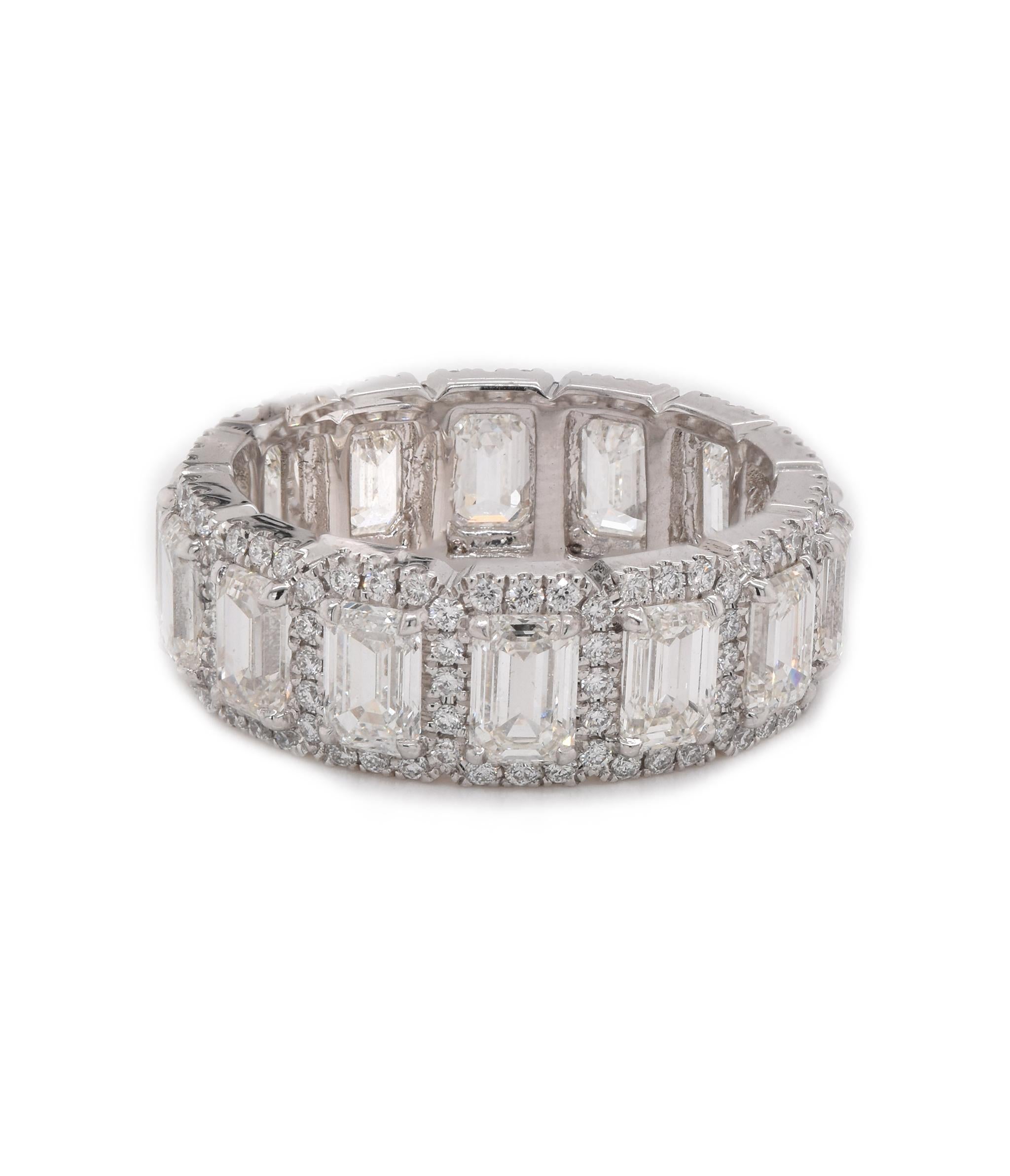 Designer: Custom
Material: platinum
Diamonds: 14 emerald cut = 4.31cttw
Color: G
Clarity: VS2
Diamonds: 154 round cut = .65cttw
Color: G
Clarity: VS
Size: 6.5
Dimensions: ring measures 7mm in width
Weight: 7.74 grams
