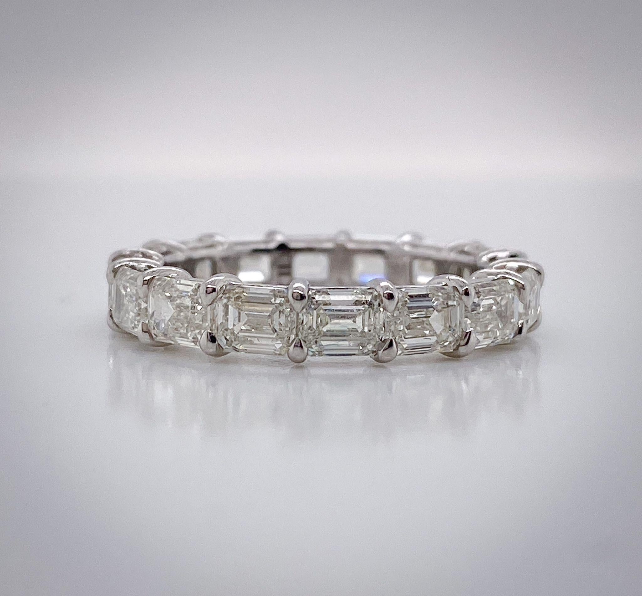 This Emerald Cut Horizontal Eternity Band features 16 Emerald Cut Diamonds, weighing 4.85 Total Carat Weight. The stones are I Color, and VS Clarity. The stones are set Horizontally in a Platinum, Shared Prong Setting. 

Need a different finger