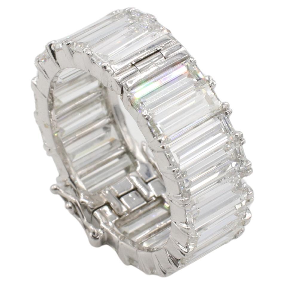Platinum 7.50 Carat Emerald Cut Natural Diamond Hinged Open Close Eternity Band Ring 
Metal: Platinum
Weight: 8.8 grams
Diamonds: Approx. 7.50 CTW graduated emerald cut natural G-H VS diamonds
Size: 7 (US)
Width: 8-8.5mm
Note: Ring has option to
