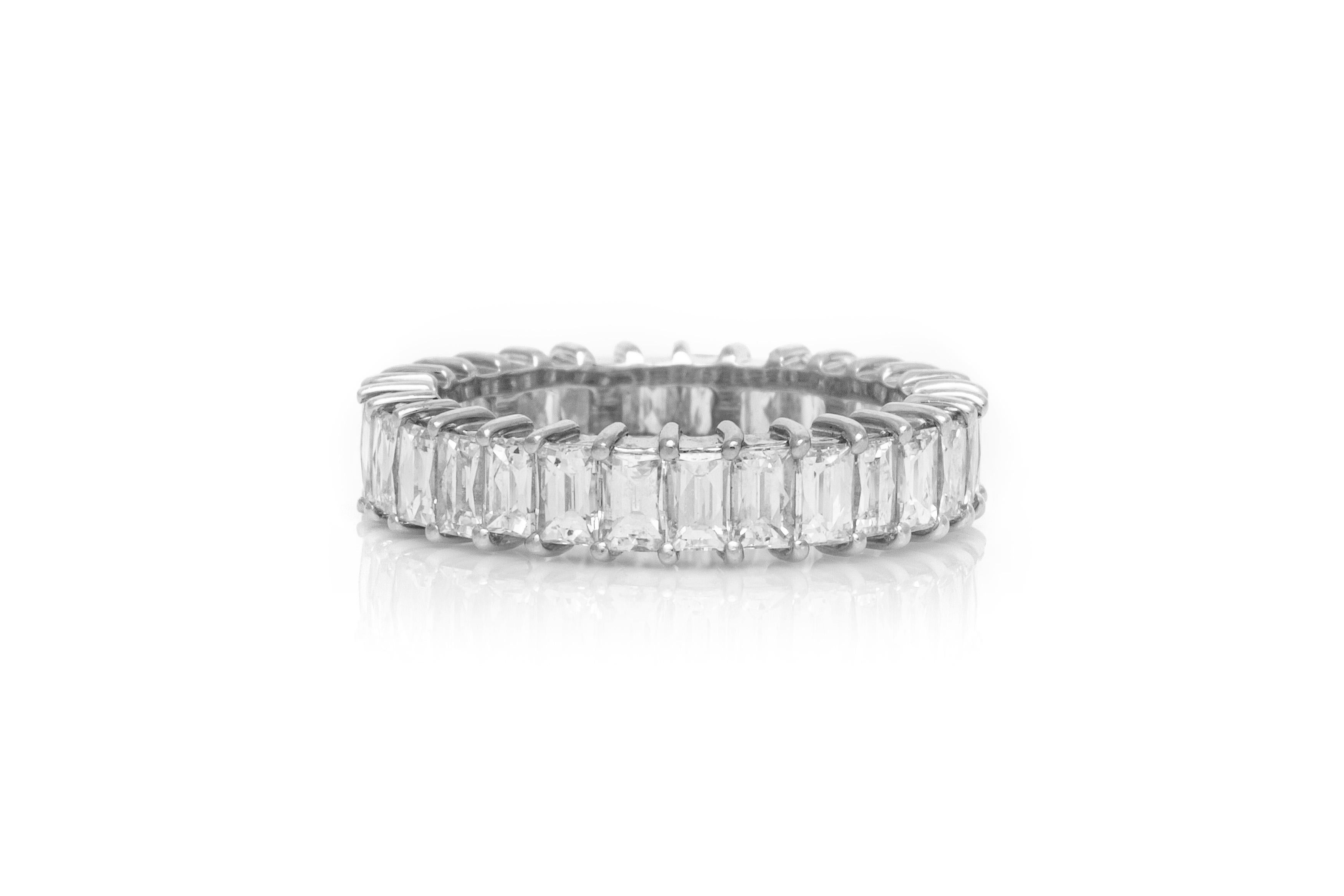 The ring is finely crafted in platinum with emerald cut all over weighing approximately total of 4.01 carat.