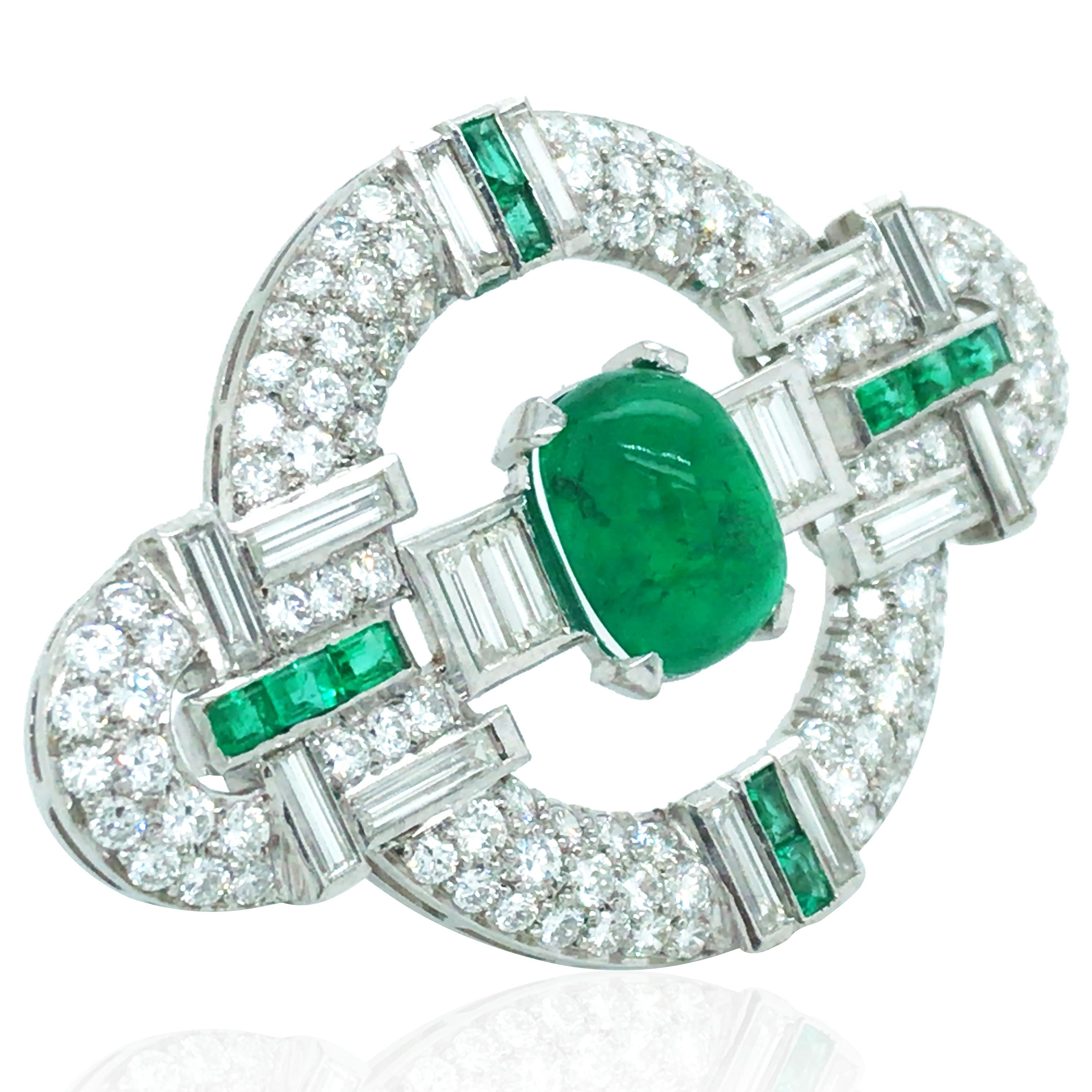 This emerald diamond brooch consists of 1 cabochon-cut and 10 baguette-cut emeralds, 16 baguette-cut and 102 round-cut diamonds. The cabochon-cut emerald is approx. 4.6ct. Emerald approx. 5.3ct in total and diamond approx. 5.1ct in total.

Emerald: