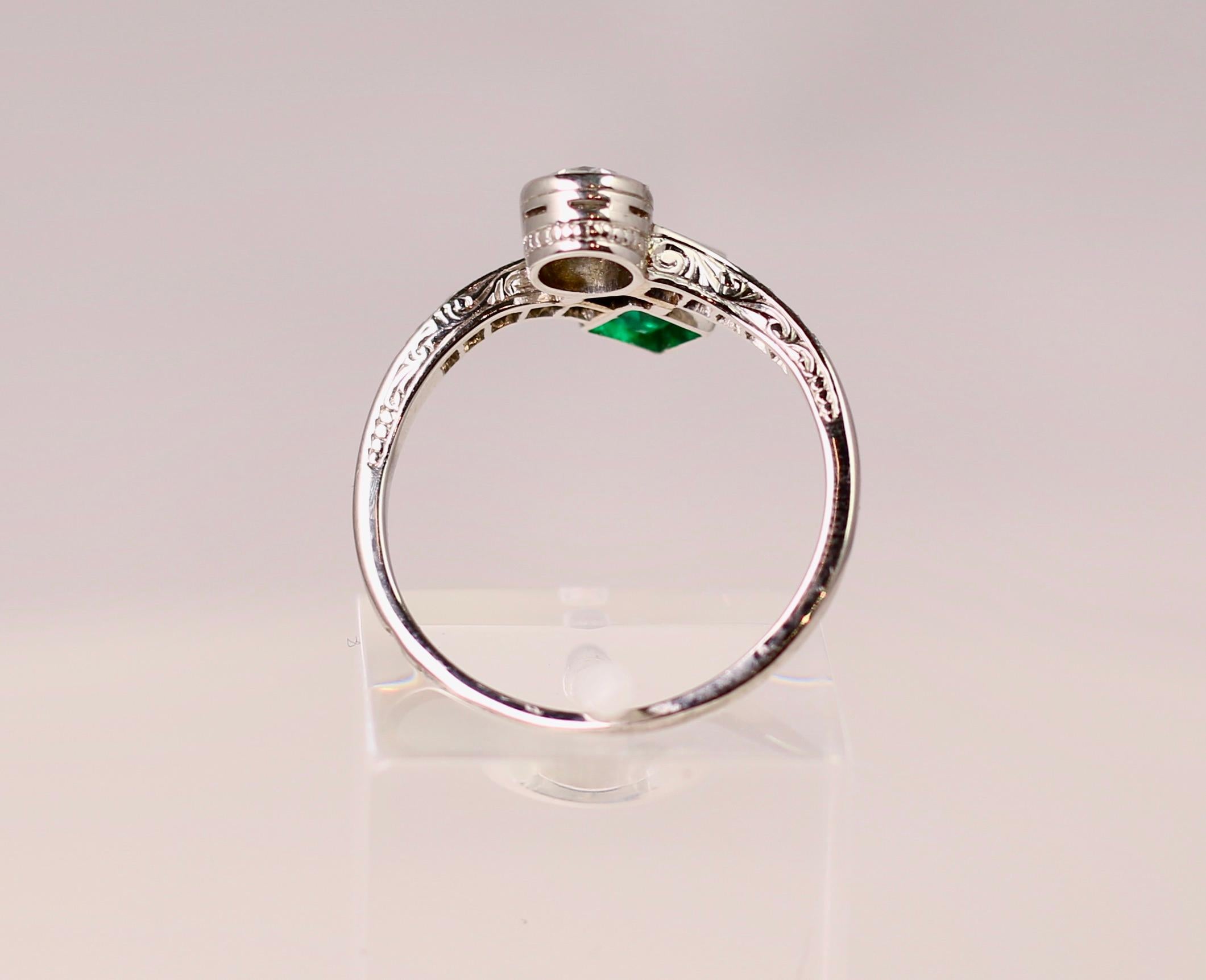 Modern Platinum Emerald and Diamond Bypass Ring For Sale