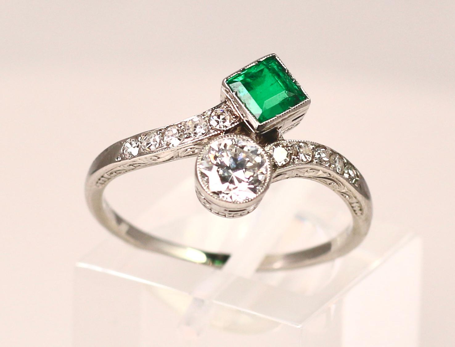Emerald Cut Platinum Emerald and Diamond Bypass Ring For Sale
