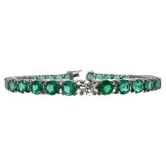 Bracciale tennis in platino con smeraldi e diamanti