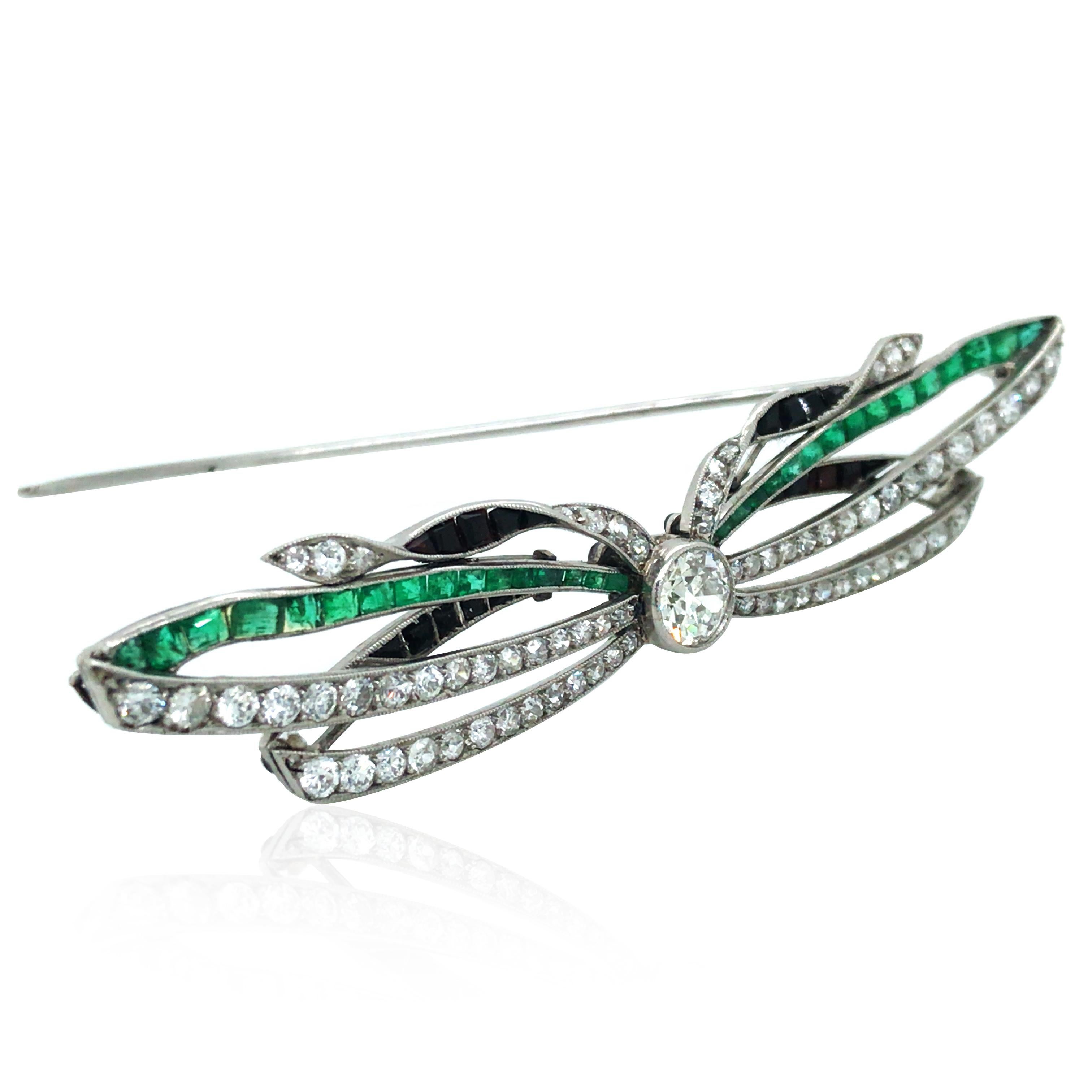 This emerald onyx diamond brooch is crafted in platinum. It consists of 33 baguette-cut emeralds, 20 onyxes and 73 round-cut diamonds. The main diamond is about 0.75ct. Diamond totally approx. 2.1ct and emerald totally approx. 0.3ct.

Emerald: