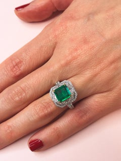 2.94 Carats Emerald Platinum Ring with White Diamond Halo in Art Deco Style