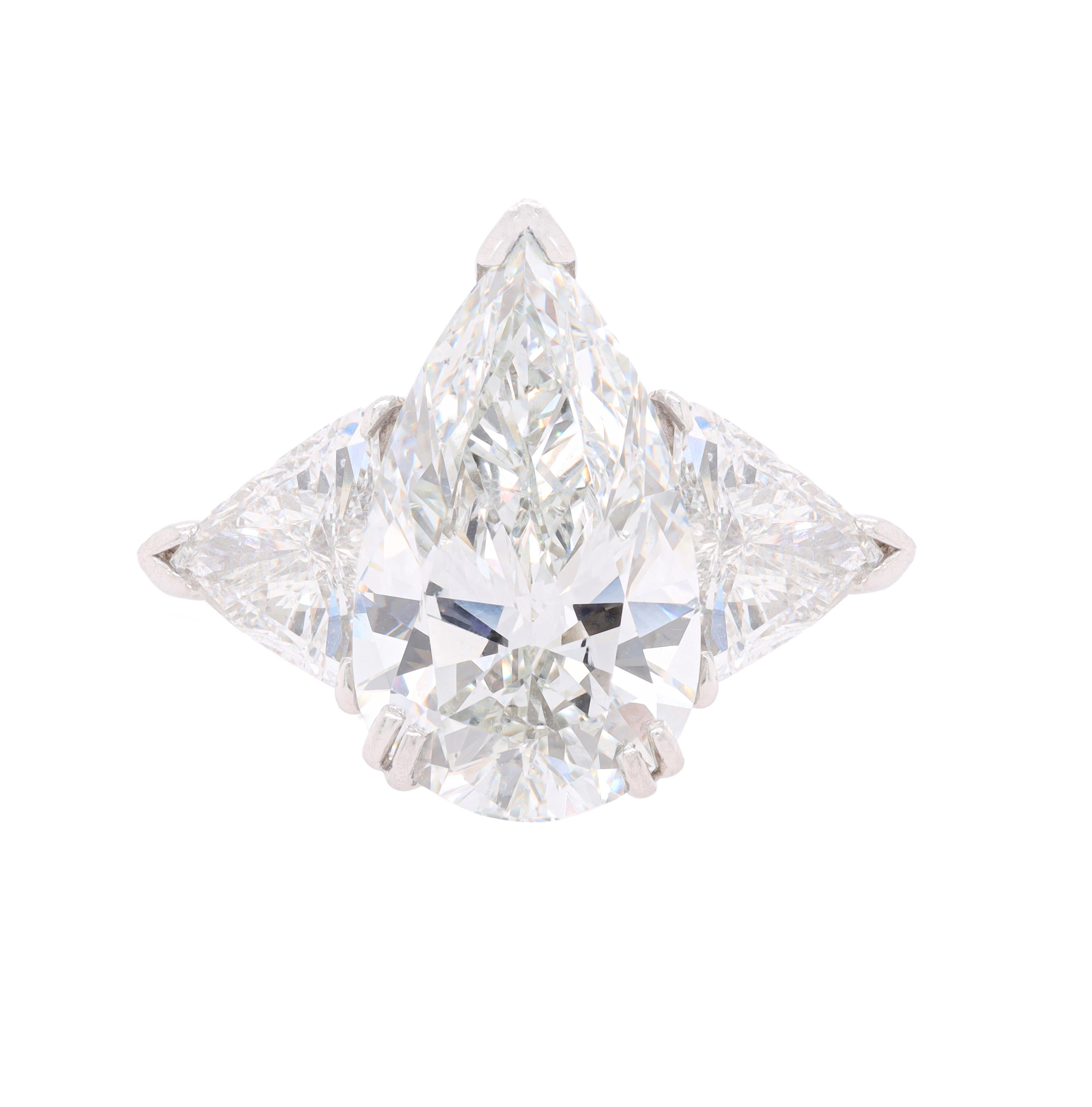 Platinum engagement ring with center igi certified 6.30 jsi1 pear shape (psc271) set with two trillians, features 1.81ct
