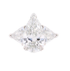 Platinum Engagement Ring with Pear Shape & Two Trillians