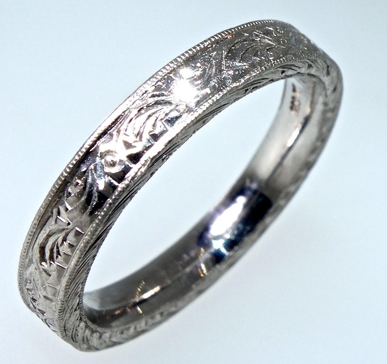 Beaudry hand made and highly engraved platinum band, new and never worn.  We have two of these bands - that are extremely similar with very slightly different engraving patterns.  We have photographed both for your convenience.   PLEASE NOTE;   Your
