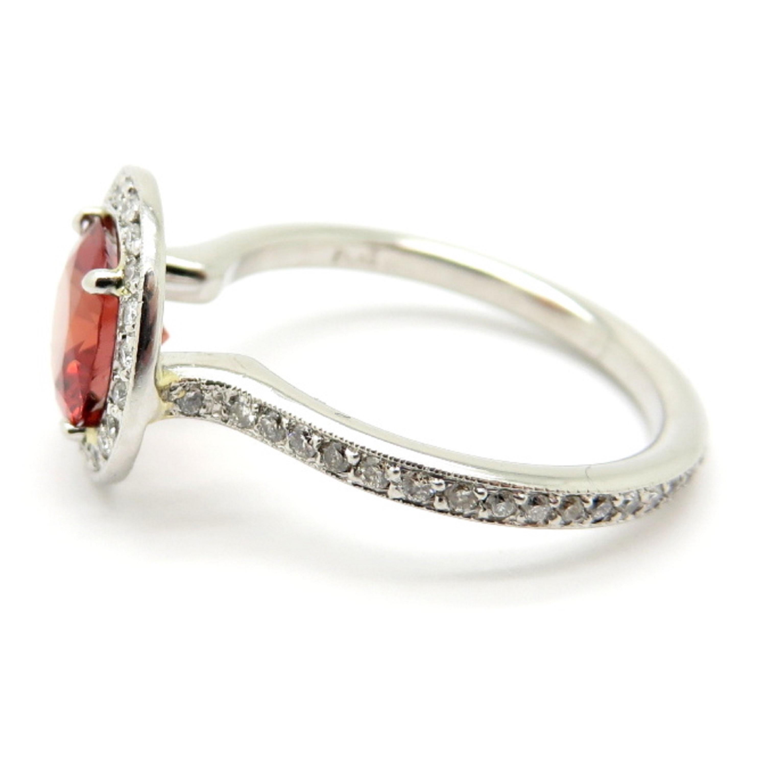 For sale is a stunning GIA Certified Red Spinel and Diamond Halo Platinum Ring!
Showcasing one (1) Near-Round shaped Brilliant Cut Reddish Orange natural Spinel with no indications of heat treatment.  
Weighing approximately 1.59 carats and