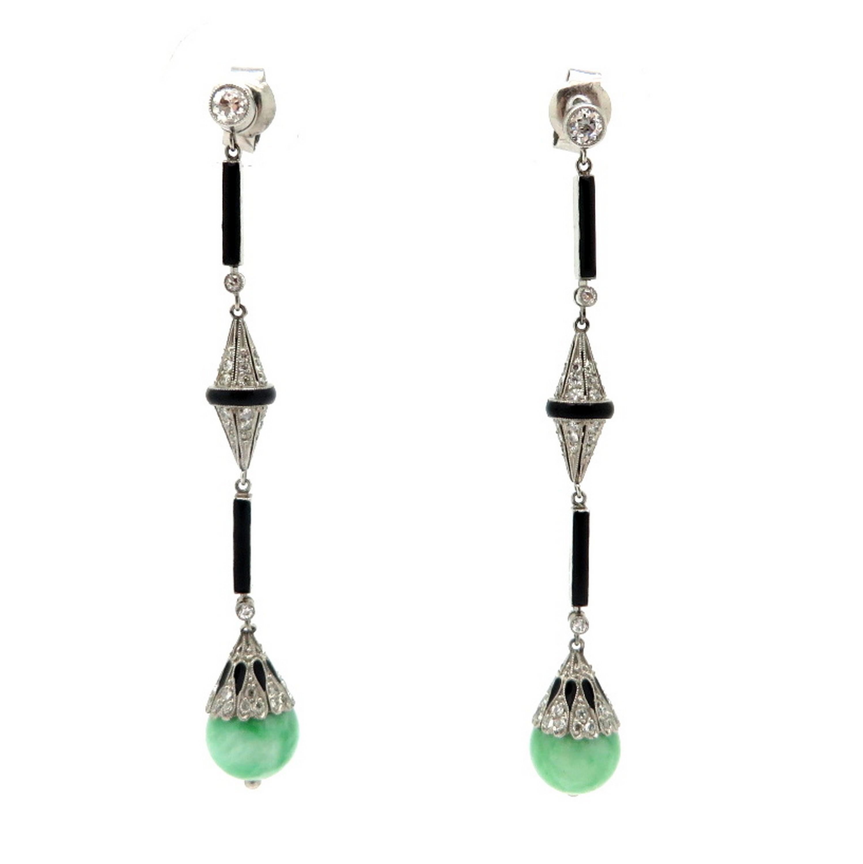 Platinum estate jade, diamond and onyx chandelier Art Deco style dangle earrings. Showcasing numerous Old European cut diamonds, with various measurements, weighing a combined total of approximately 1.17 carats. Accented with two fine quality round