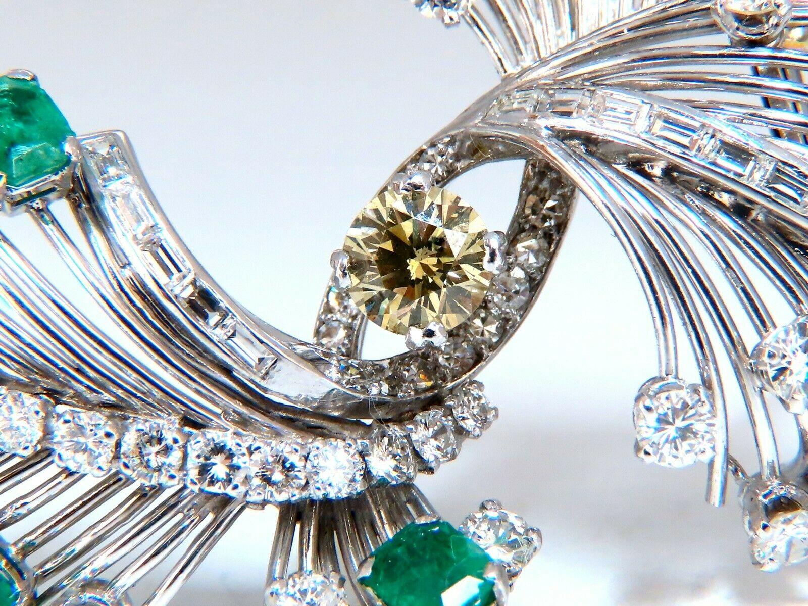 GIA Certified Estate Platinum Emerald pin.

GIA Certified: 1.07ct natural fancy 

Brown Green yellow round diamond. Si-1 clarity.


Side natural emeralds: 6.00ct Columbian, Vivid Greens.

Side round White diamonds:  5.50ct F-G Color Vs-2